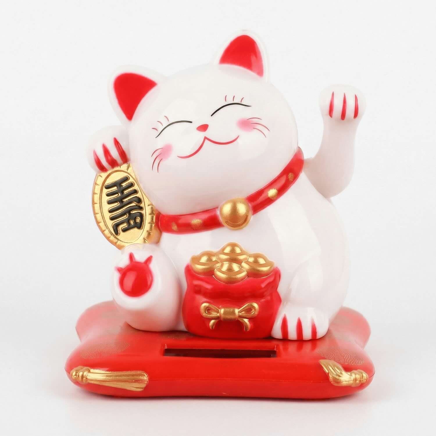 White kawaii lucky cat fortune cat Chinese figurine with waving paw and gold coin on red solar base